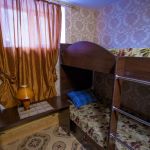 Уютная кровать в женском номере на 4 персоны